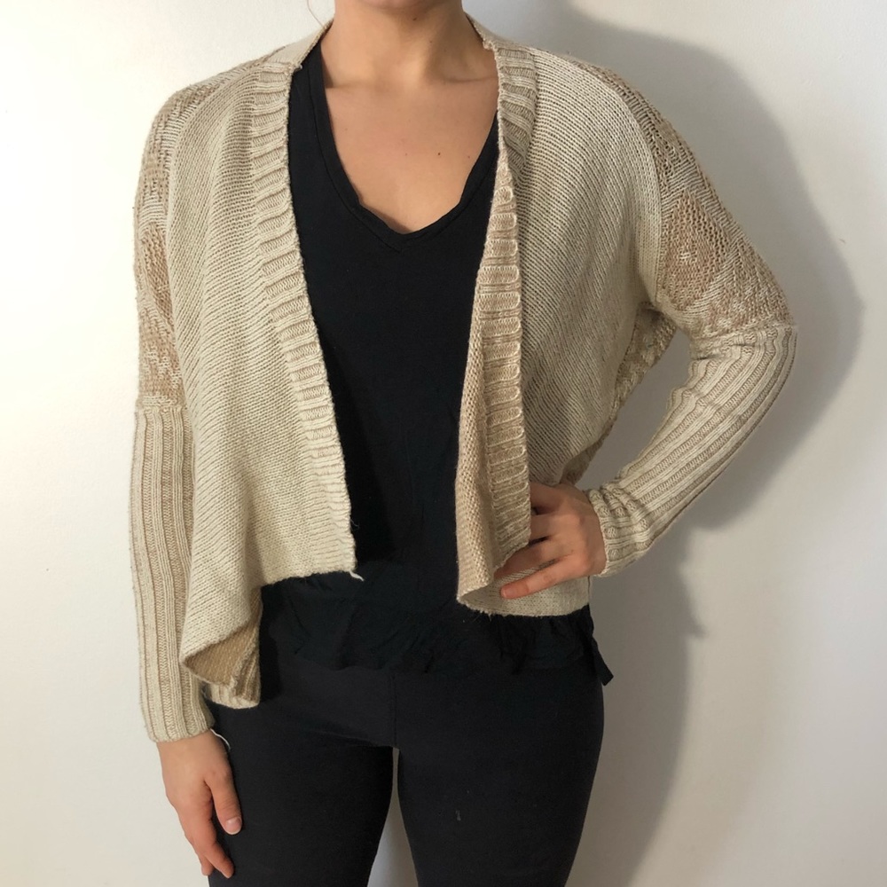 Cropped beige cardigan.
